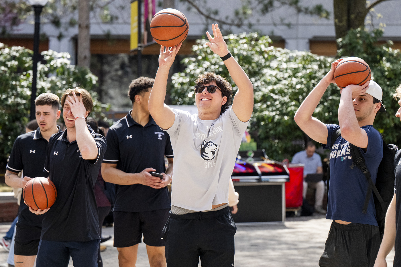 Students shoot basketballs on campus during Giving Day festivities. 