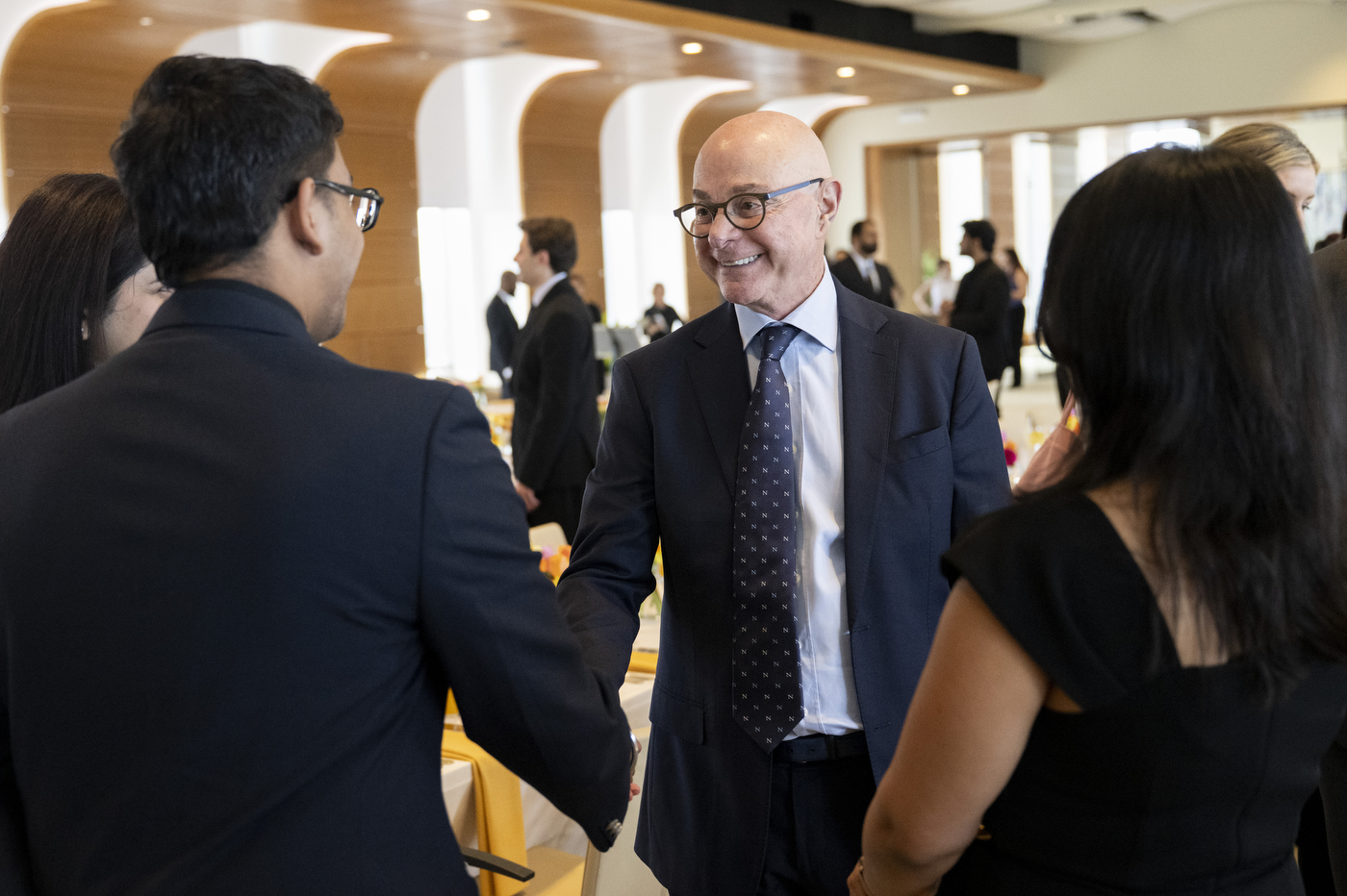 Attendees mingle and converse with President Aoun at the Laurel and Scroll Induction Ceremony.