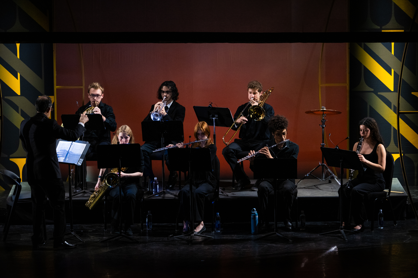 A group of musicians plays on stage at the Academic Honors Convocation. 
