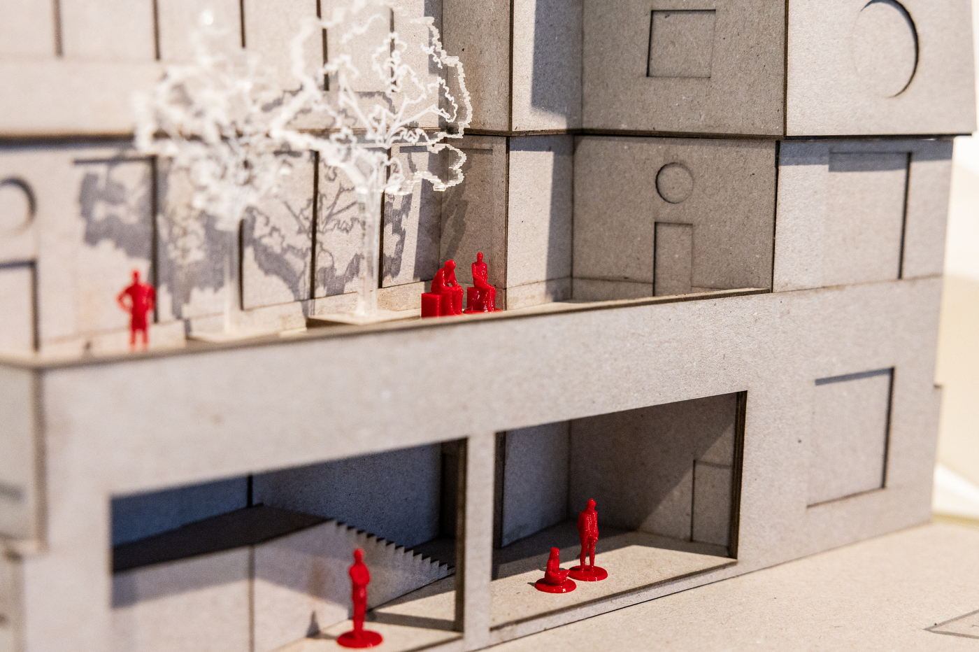 An architectural model by a Northeastern student, featured a closeup of model trees and people along a model building