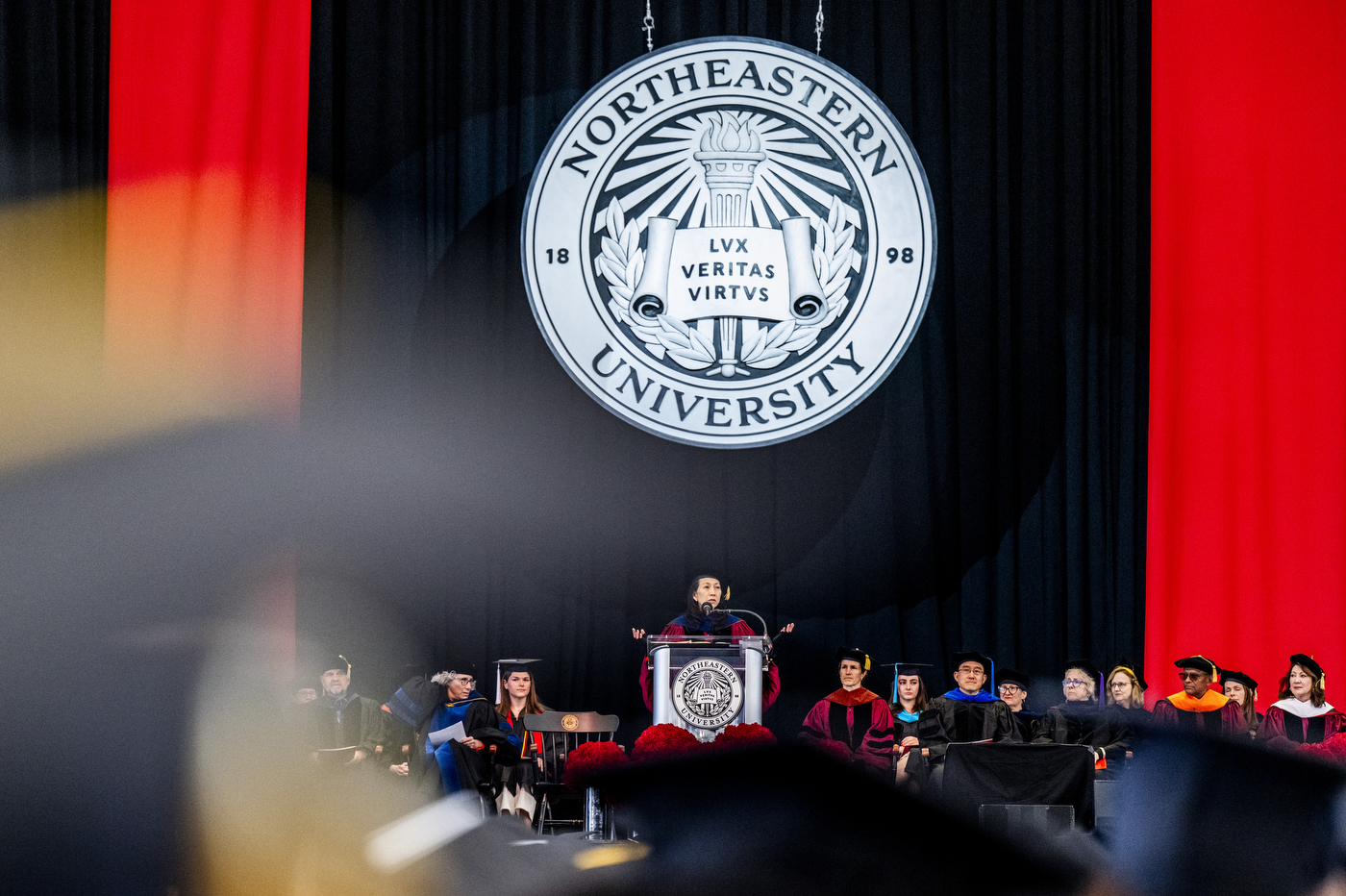 A shot of the full stage as a keynote speaker address students.