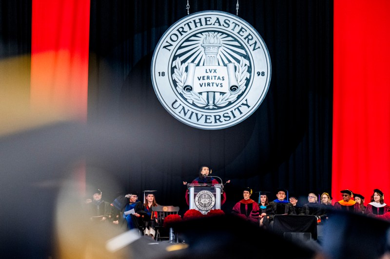 A wide shot of the stage during the CSSH graduation ceremony, with President Aoun and other faculty on stage.