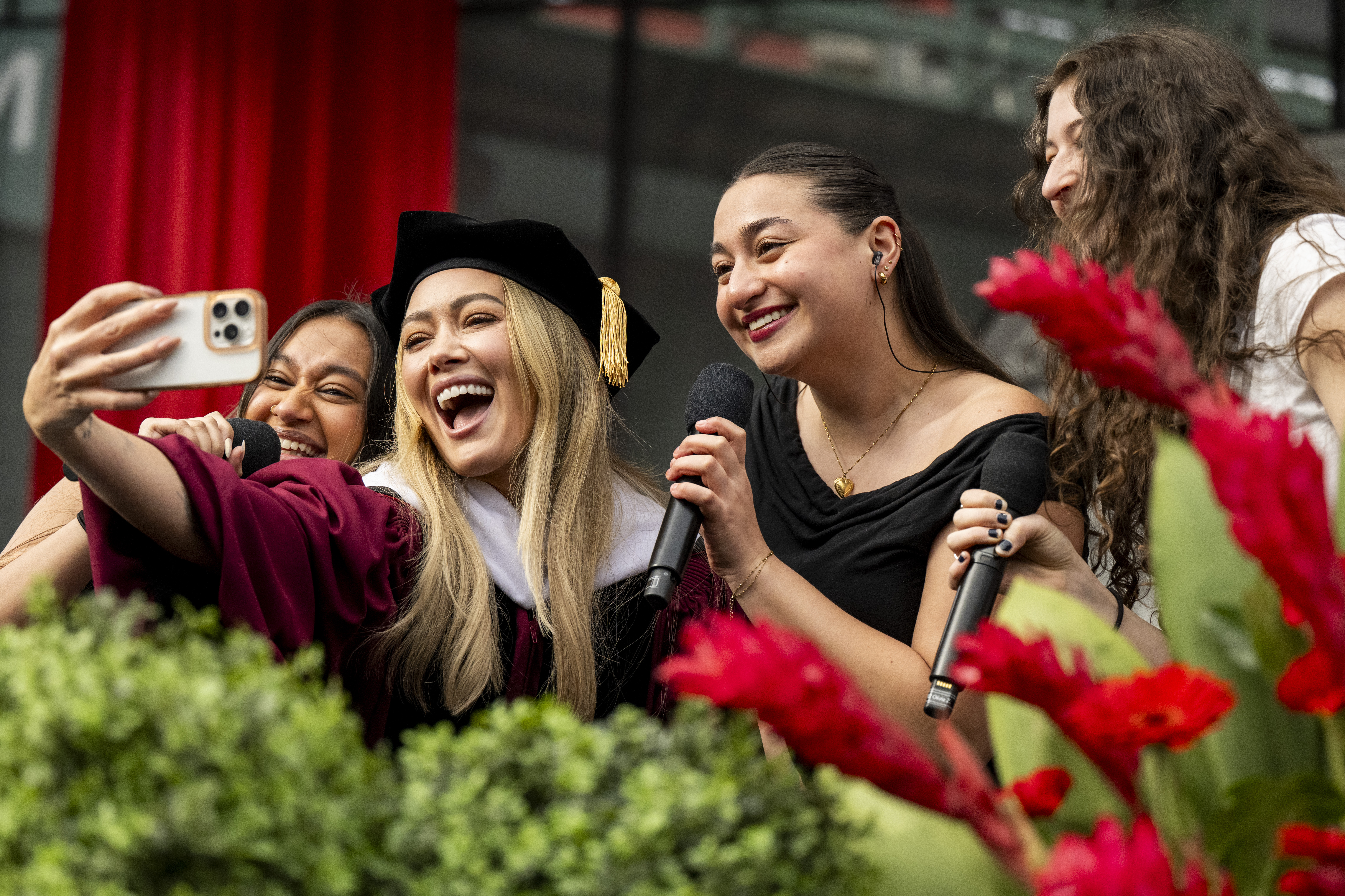 Hilary Duff takes a selfie with student performers.