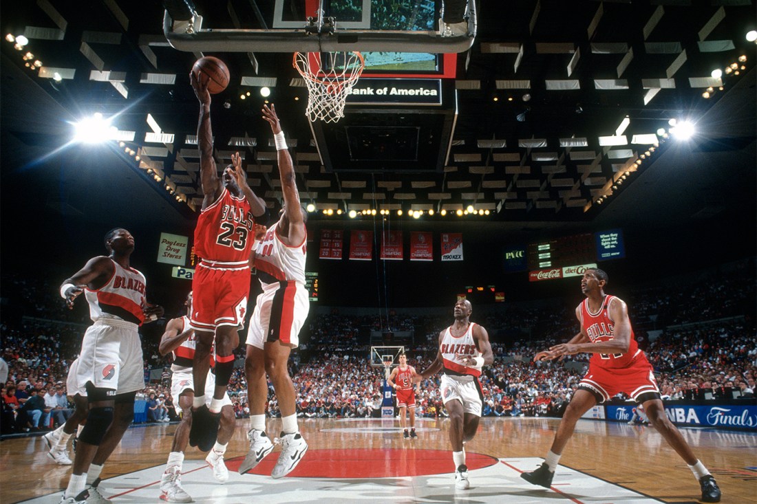 Michael Jordan #23 of the Chicago Bulls goes in for a layup against the Portland Trail Blazers during the 1992 NBA Finals.