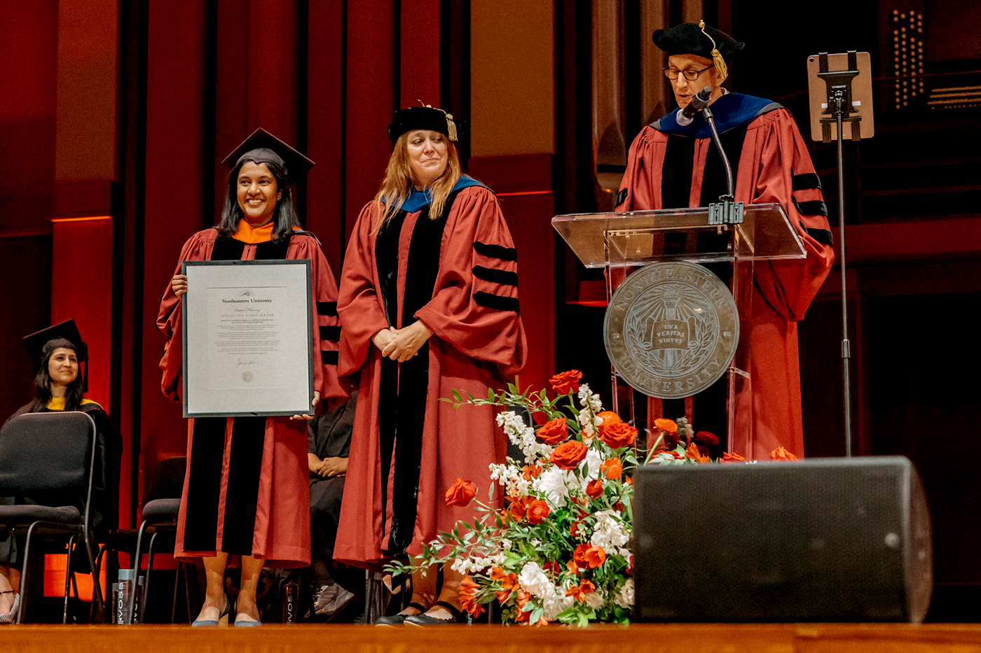 Sangeetha Visweswaran, vice president of engineering at Microsoft, holds the certificate she received from university leaders while standing next to Rebecca Steffenson, associate dean.