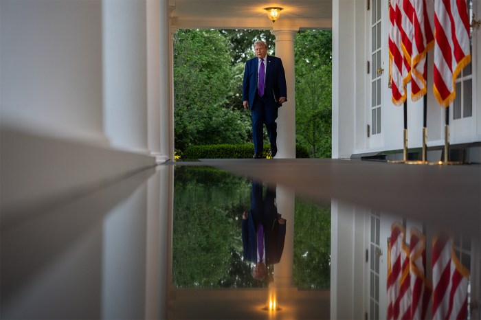 President Donald Trump walks in the Rose Garden at the White House.