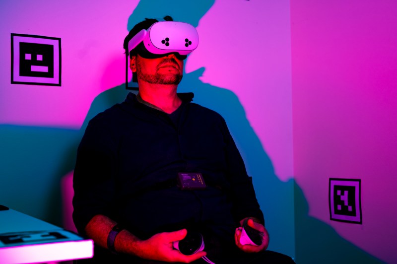 A close up of a Northeastern student using VR tech in a lab.