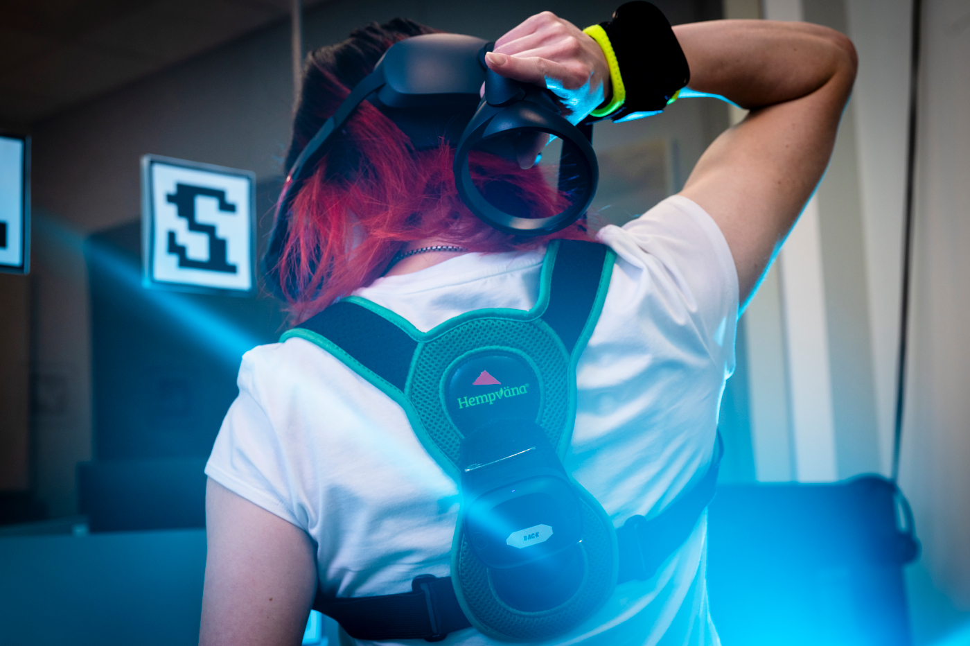 The back of researcher wearing VR tech.