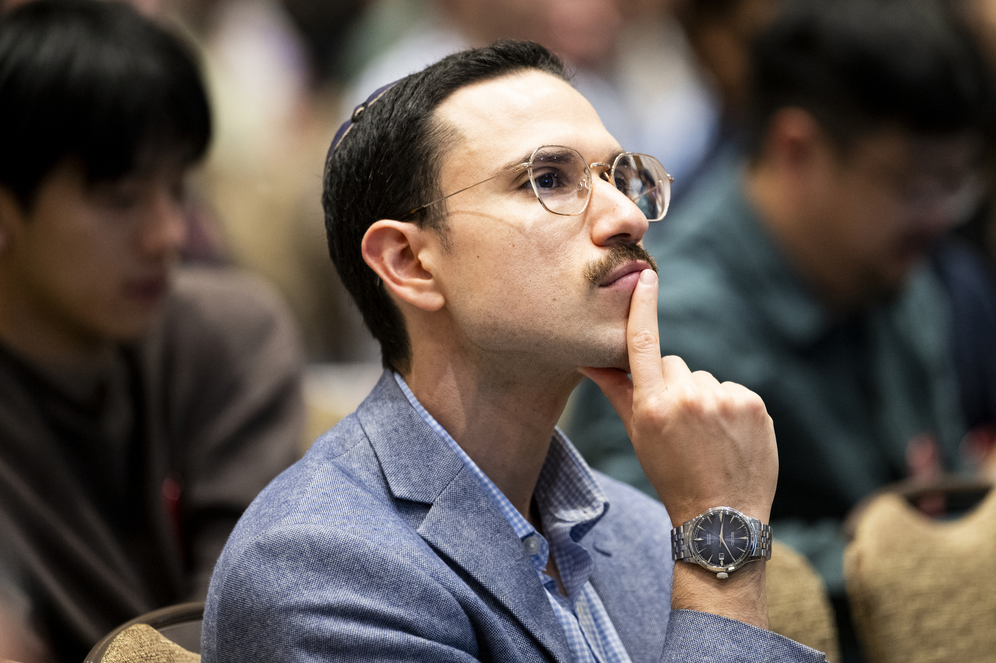 An attendee listening attentively during a session at NetSci Boston 2026.