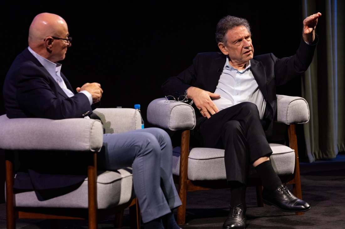 Sir Lucian Grainge gestures while speaking during a fireside chat with Northeastern President Joseph E. Aoun at the 2026 Global Leadership Summit in London.