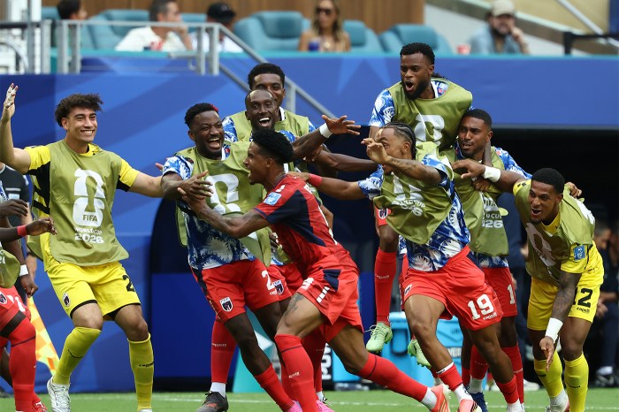 Players with Cape Verde celebrate on the field after first goal.