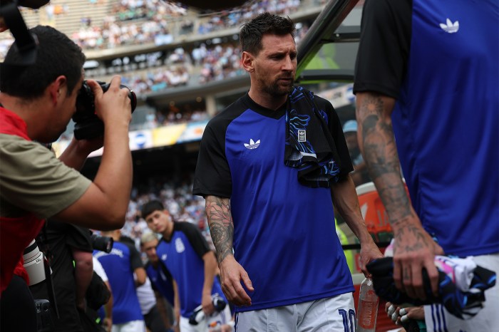 Lionel Messi, dressed in Argentina jersey, walks through the tunnel at the friendly match against Honduras.