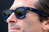 An up-close shot of a person wearing black Ray-Ban smart glasses.