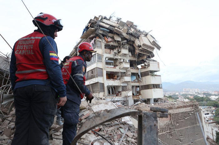 Rescue workers search through the rubble after an earthquake.