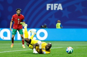Haiti goalkeeper Johny Placide stretched in the air to save the ball on the pitch as a shot goes wide during the Group C World Cup match against Morocco in Atlanta.