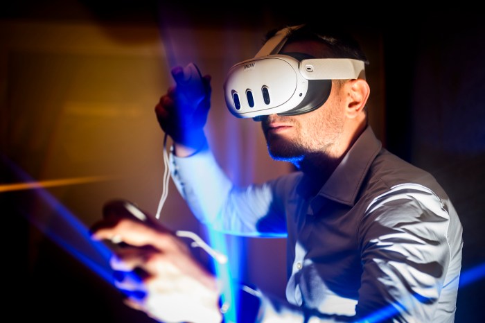 A person wearing a VR headset demonstrates a game design.
