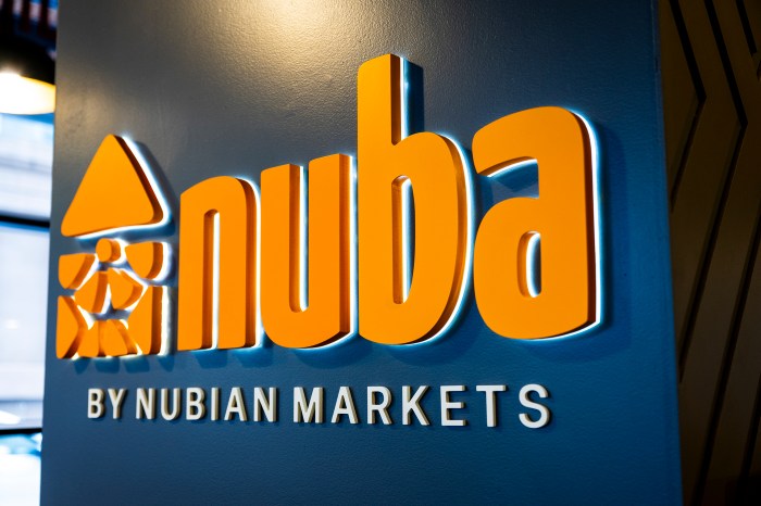 Nuba by Nubian Markets sign on blue wall inside Northeastern's Lightview dormitory.