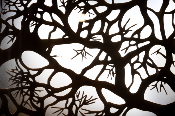 Decorative tree-branch mural inside Nuba by Nubian Markets.