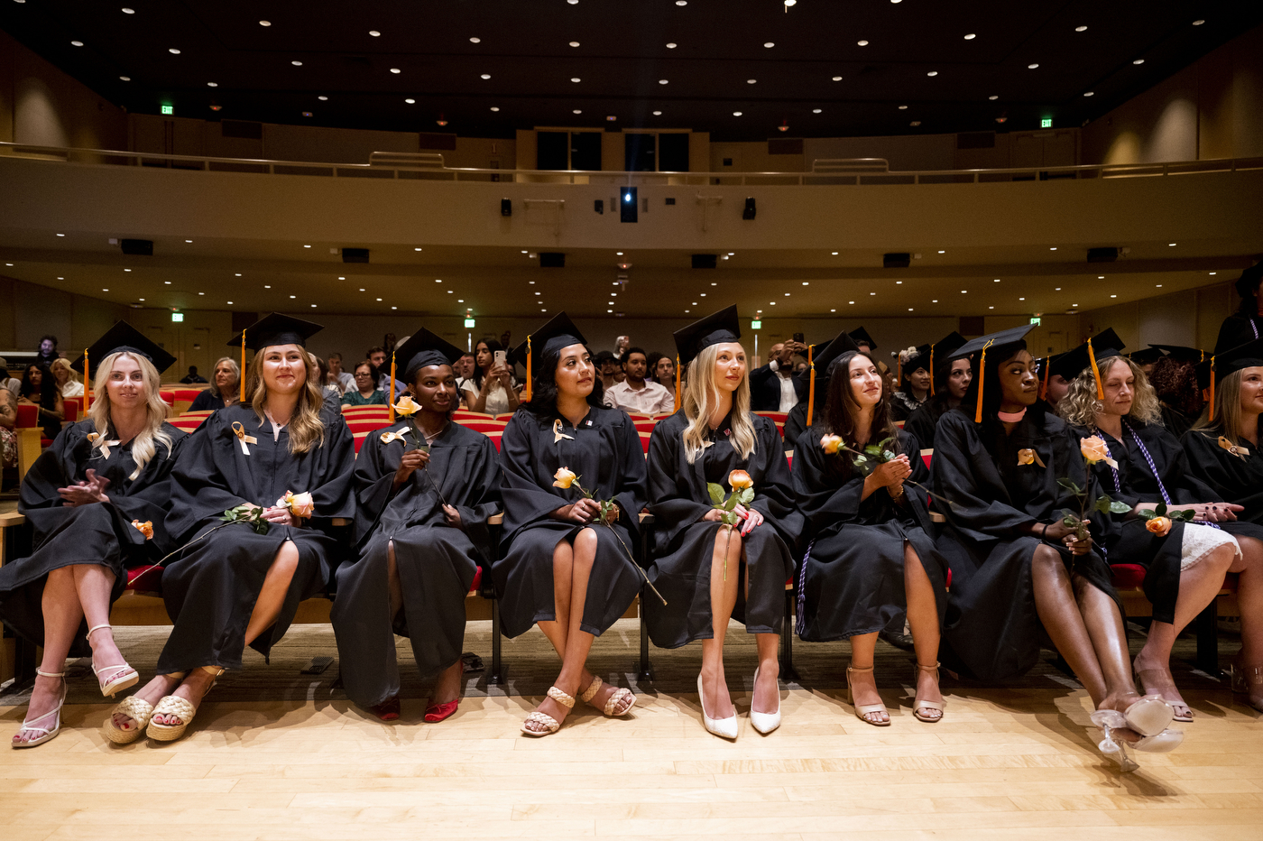 Wide view of School of Nursing graduates seated in rows during the Pinning Ceremony in Blackman Auditorium.