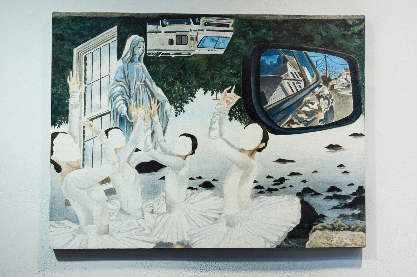 Surrealist painting featuring four faceless figures in white dresses gathered beneath a towering Madonna-like figure, with a seaside landscape, suburban houses, an RV and a rearview mirror incorporated into the scene.