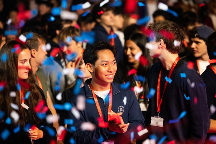 Students celebrate amid falling red, white, and blue confetti