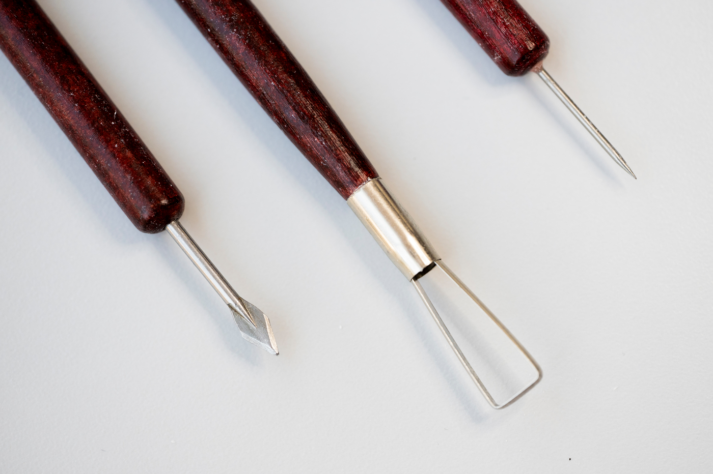Carving tools laid out on a table.