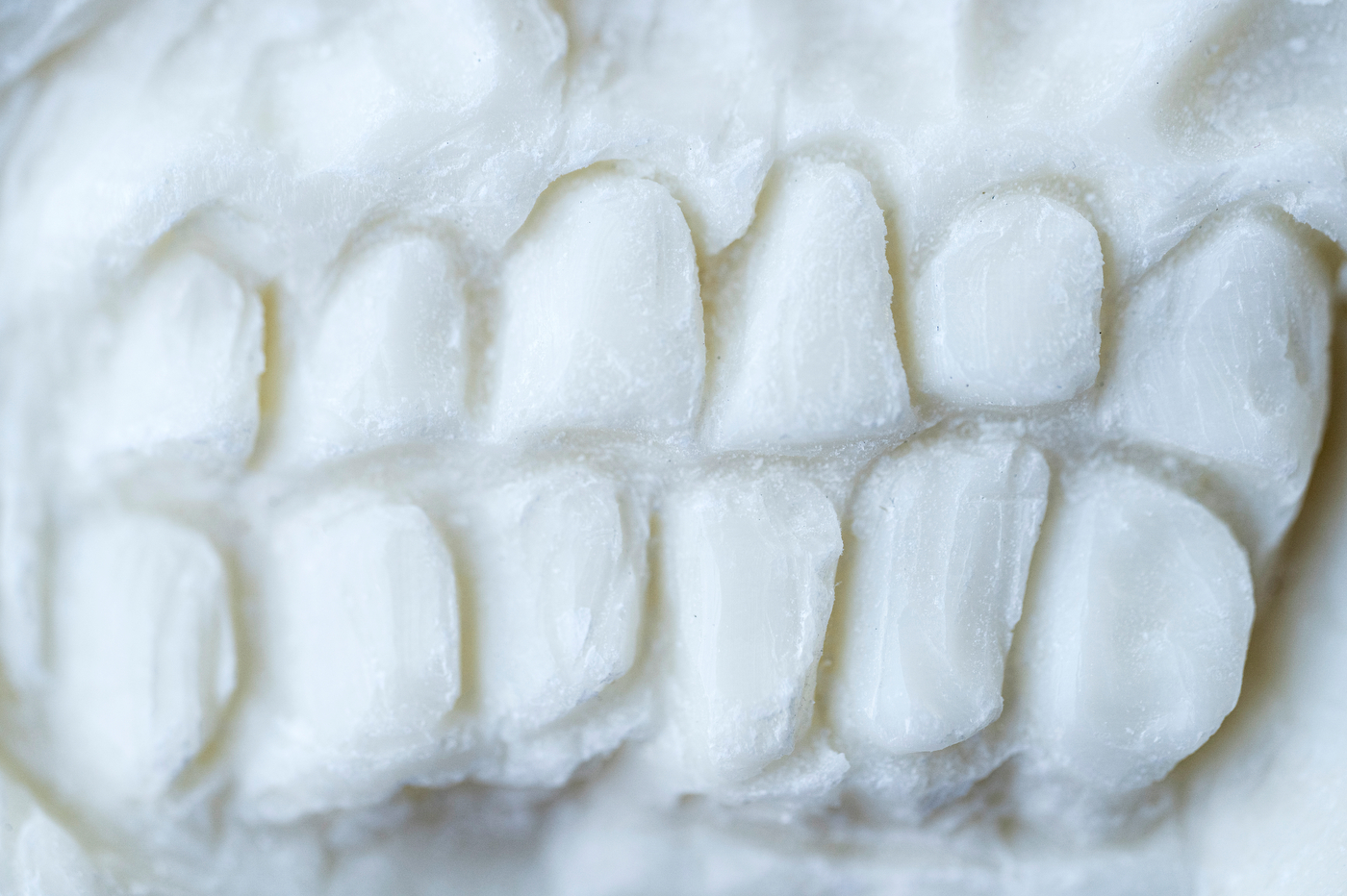 A close up of teeth carved out of soap.