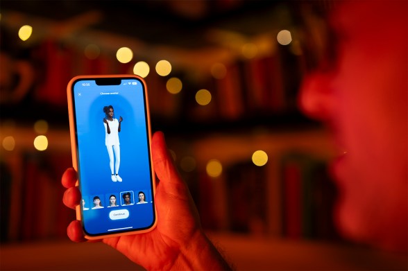 This illustration photo shows a user interacting with a smartphone app to customize an avatar for a personal artificial intelligence chatbot.