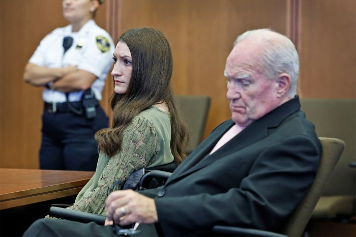 Lindsay Clancy and Kevin Reddington sitting in a courtroom, both with tense expressions.